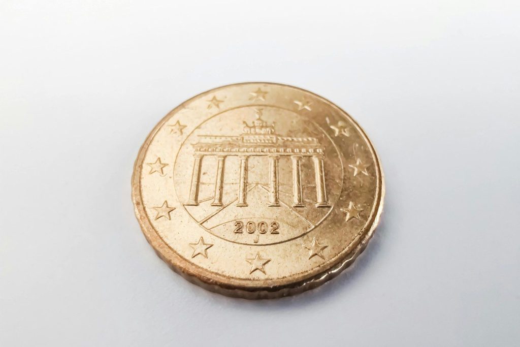A detailed view of a 2002 Euro coin featuring the Brandenburg Gate, emphasizing currency and design.